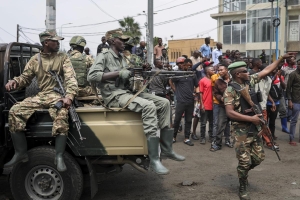 Des membres du M23 dans une rue de Goma après la prise de la ville.